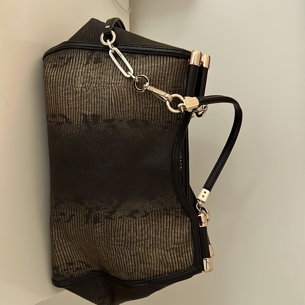 Beautifully crafted Coach bag. Unique Gold and black leather snake skin pattern